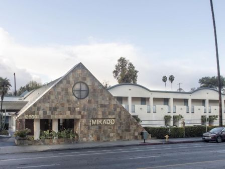 This image shows a building with a sign reading 