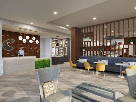 A modern hotel lobby with a reception desk, seating area, yellow and gray chairs, wooden decor elements, and a small convenience store.